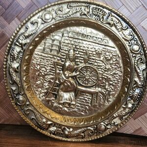 Vintage Brass Stove Plate Witch Spinning Wheel Wall Decor Collectible Hanging 9"